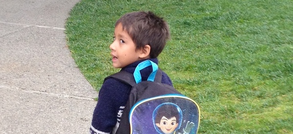 Boy with backpack going back to school
