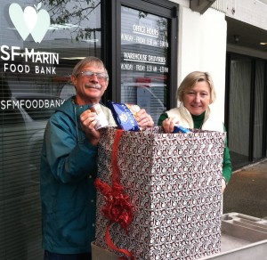 Marcia Custer, Marin General Manager and a volunteer inspect our food donation.