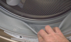 To avoid mildew issues with your front-loading washing machine, clean the rubber door seal on a regular basis. Photo: HPS Palo Alto, Inc. (2016)